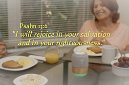 Woman listening to prayers from My Mood Bible™ at breakfast